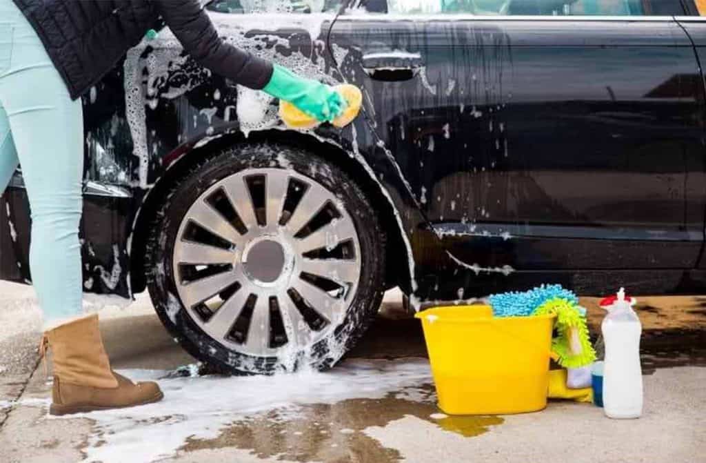 Teenager washing car for money 