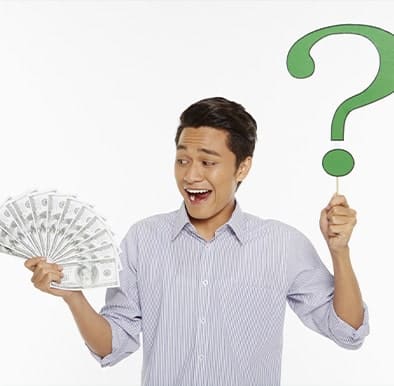 Young man holding a green question mark and dollar bills, wearing a collarded shirt in article benefits of tfsa vs rrsp