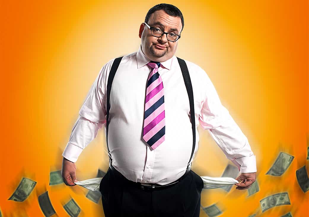 chubby man in dress clothes with pockets out indicating no money