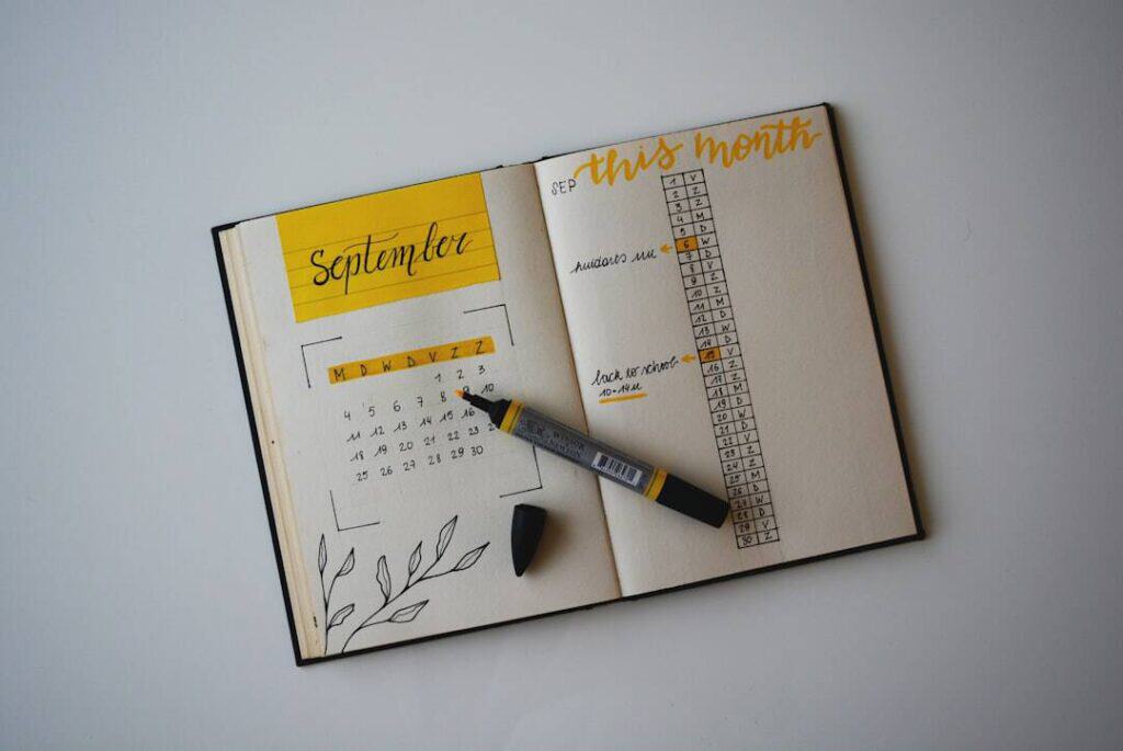 Open planner with September page and calendar for the month.