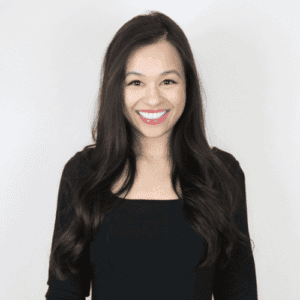 headshot of erika kullberg wearing black shirt with a smile lawyer turned youtube star for personal finance.