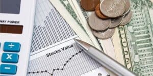 graph, calculator, stock chart, american USD dollars and change with a pen