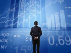 stock market charts on a screen representing investing basics for high school students
